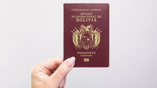 close up of a bolivia passport held in hand