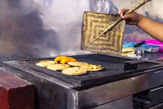 indigenous quechua women selling bakery products in the Saturday farmer's market