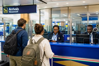Travellers clearing the immigration process Travellers clearing the immigration process