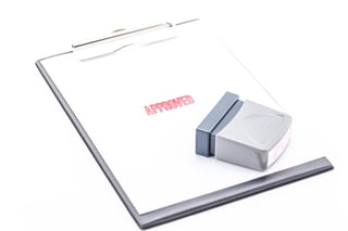 concept for business stamp approved on clipboard