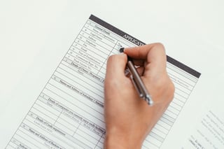 female hand writing with pen