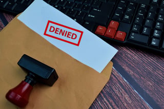 Red handle rubber stamper and denied