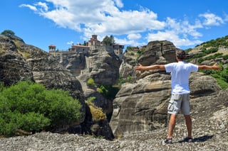 Man In Front Of The Monastery Of St Nicholas Anapafsas