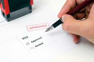 Visa And Approved Stamp On A Document Form Immigration
