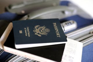 An Image Of A Passport And Tickets On A Valise
