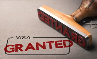 Granted Printed On A Rectangular Box With The Word Visa Immigration
