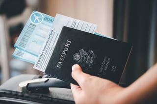 People Holding Passports And Coronavirus Vaccination Record Card Map