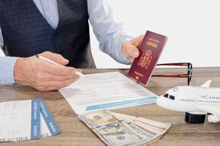 Young Businessman With International Passport And Avia Ticket Filling