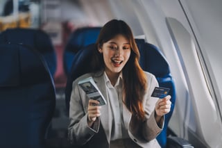 Young Businesswoman Holding Credit Card Near Blurred