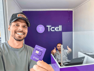  man holding a T cell SIM CARD